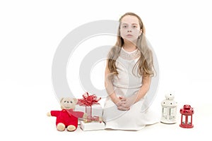 Child or girl with gift box, toy bear and lantern