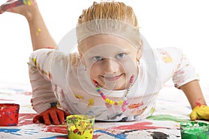 Child smiles happy during painting session