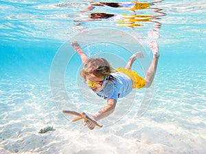 Child snorkeling. Kids underwater. Beach and sea