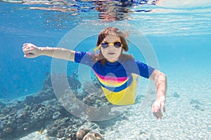Child snorkeling. Kids underwater. Beach and sea
