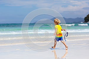 Child snorkeling on tropical beach. Kids snorkel