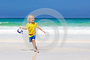 Child snorkeling on tropical beach. Kids snorkel