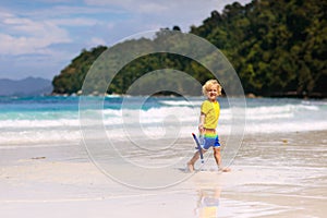 Child snorkeling on tropical beach. Kids snorkel