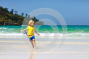 Child snorkeling on tropical beach. Kids snorkel