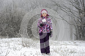 Child with a snow shaped heart