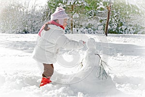 Child and snowman