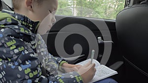 Child solving chess puzzles during car travel