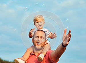 child son father family happy playing kid childhood dad love fun smiling little man soap bubble summer love