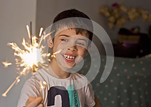 Child with a sparkler in hand