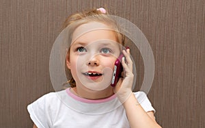 child speaks on smartphone