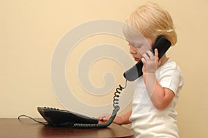 Child speaks on telephone