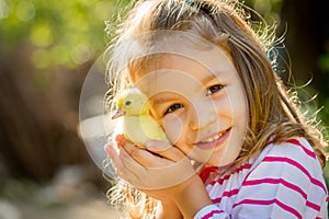 Child with spring duckling