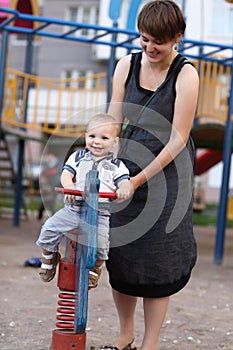 Child on spring toy horse