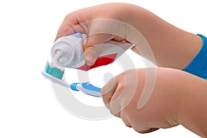 Child squeezes the toothpaste