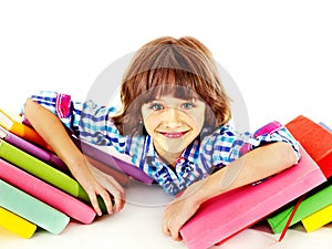 Child with stack of books.