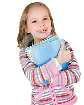 Child with a stack of notebooks