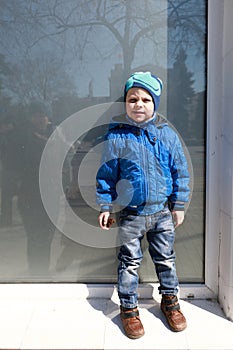 Child standing on window tide