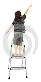 Child on Step Ladder Reaching Up