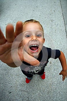 Child sticking his hand out