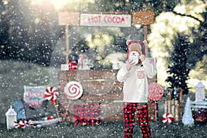 Child stood by hot cocoa stand