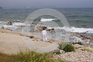 Child on stormy beach