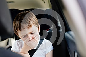 Child suffers from motion sickness in car