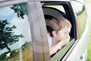 Child suffers from motion sickness in car