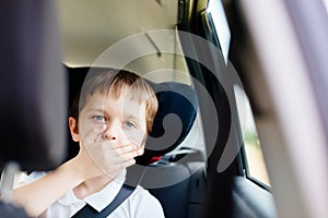 Child suffers from motion sickness in car