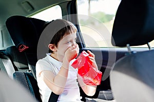 Child suffers from motion sickness in car