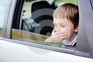 Child suffers from motion sickness in car