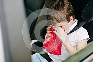 Child suffers from motion sickness in car