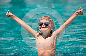 Child in summer swimming pool. Activities child on the pool, children swimming and playing in water, happiness kids and