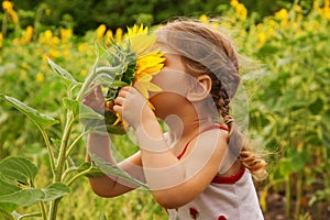 Child and sunflower