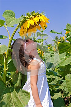 Child sunflower on field