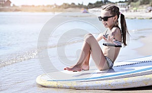 Child swiming on the board.