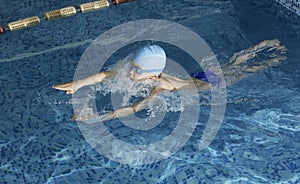 Child swimmer in swimming pool