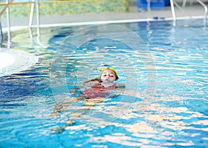 Child swimming backstroke photo