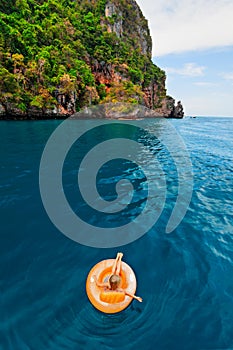 Child swimming with fun on inflatable floating ring