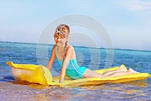 Child swimming inflatable beach mattress.