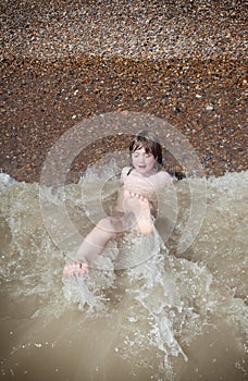 Child swimming playing sea