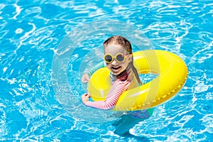 Child in swimming pool. Kids swim. Water play.