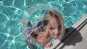 Child Swimming in Pool, Smiling Kid, Girl Portrait Enjoying Summer Vacation