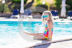 Child in swimming pool on summer vacation