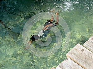 Child Swimming Under Water
