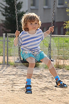 CHILD ON SWING