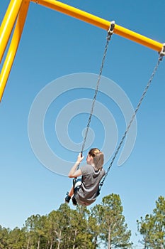 Child swinging in the park