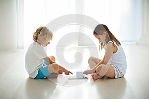 Child with tablet computer. PC for kids.