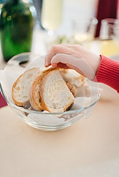 Child take a piece of a bread