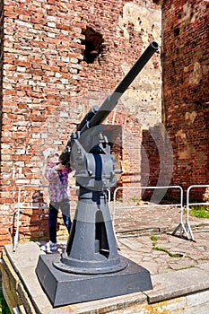 A child takes aim from an anti aircraft gun of the Second World War