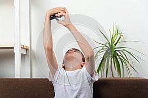 Child takes selfie on smartphone. Boy with smart phone in his hands